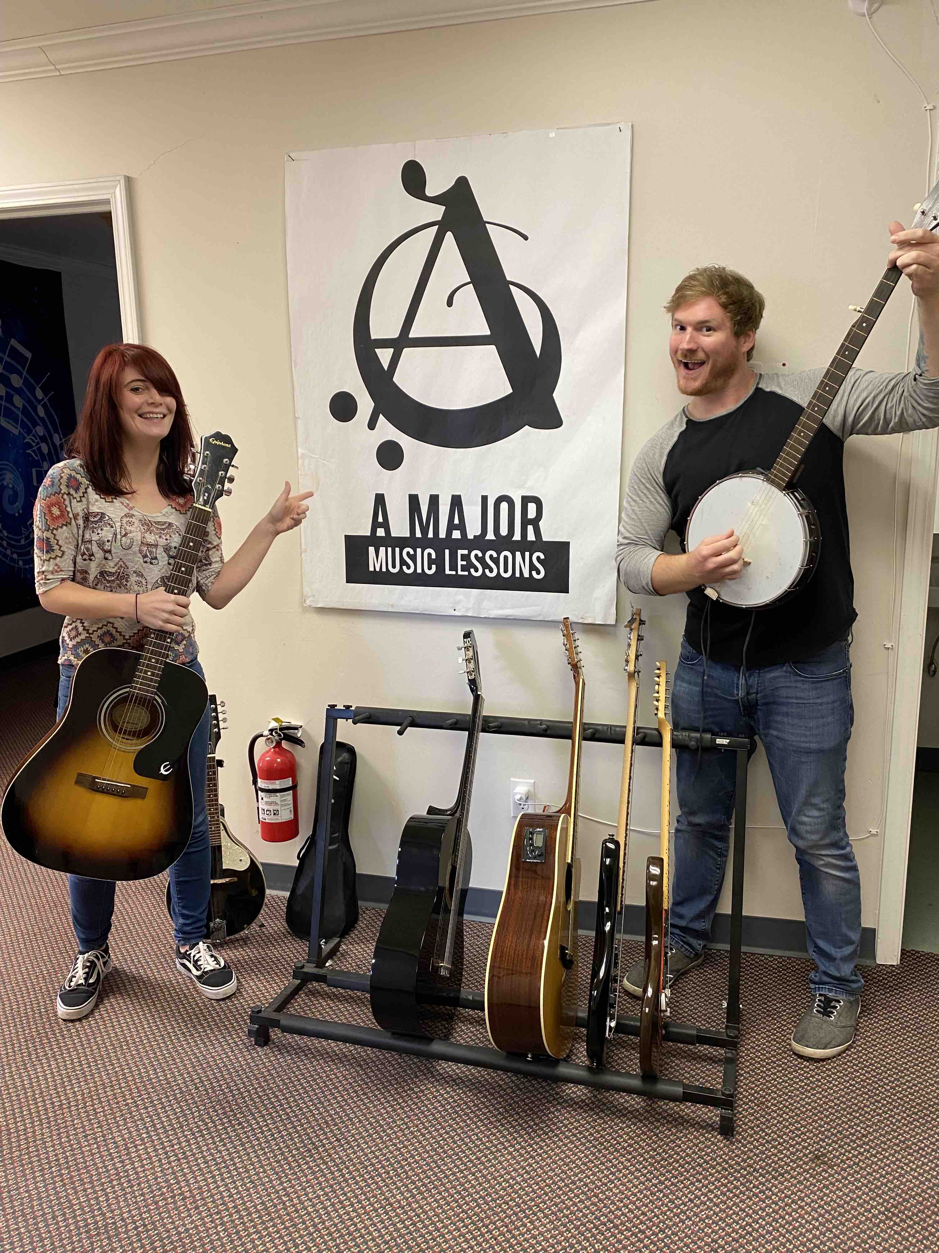 Greg and a student holding various instruments